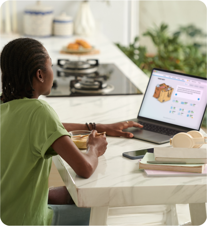 Teenager in his living room exploring financial literacy through Banzai’s curated collection of activities, helping him build essential money skills.