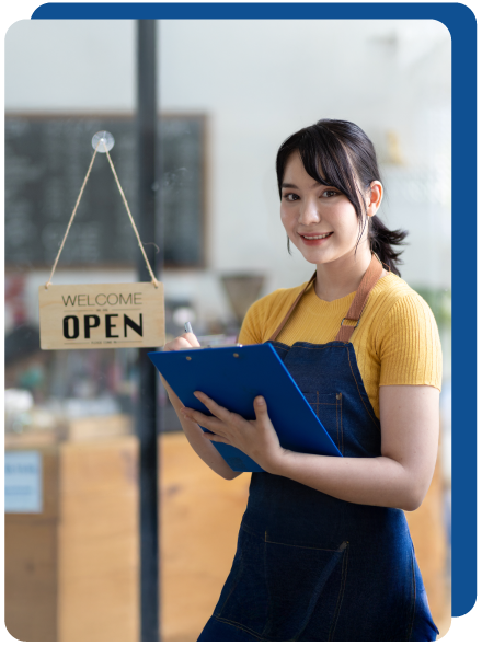 Small business owner advertising that his store is open.