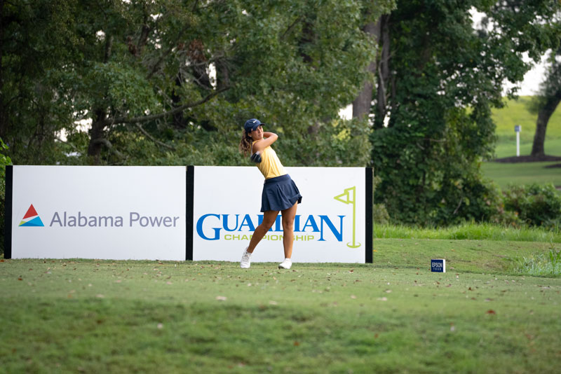 Professional golfer teeing off at the LPGA’s Epson Tour sponsored by Guardian Credit Union.