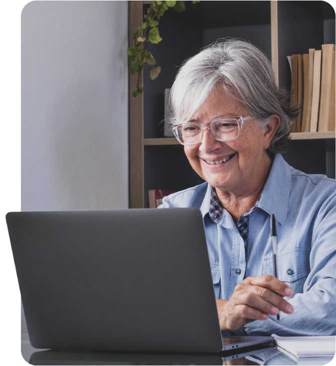 Mature woman feeling safe and secure while using Guardian Credit Union’s  Online Banking from home.