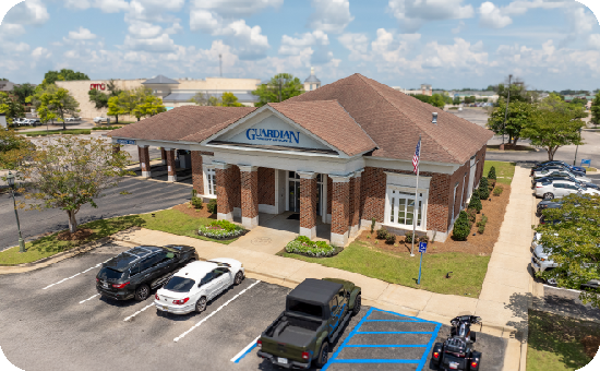 Exterior view of Guardian Credit Union’s Taylor Road branch building, with visible parking lot and landscaped surroundings