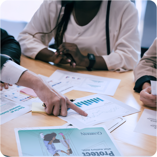 Team reviewing Guardian Credit Union group benefits plans, highlighting  insurance coverage options tailored for  the business and employee wellness.