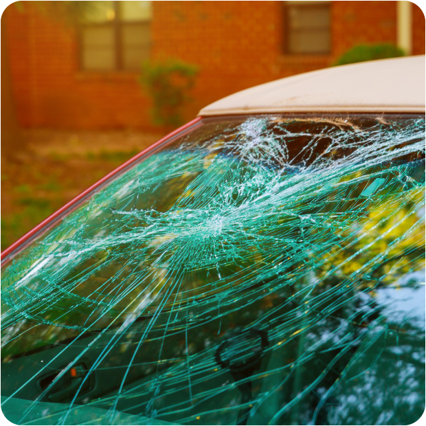 Windshield damaged by hail after a thunderstorm.