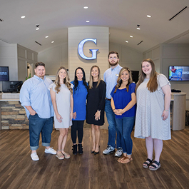 The Guardian Credit Union Wetumpka team standing together inside the branch, proudly serving and supporting the local community.