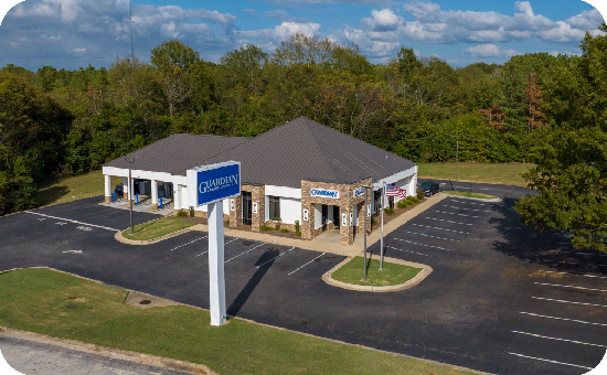 Exterior view of Guardian Credit Union’s Eastdale branch building, with visible parking lot and landscaped surroundings