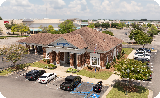 Exterior view of Guardian Credit Union’s Taylor Road branch building, with visible parking lot and landscaped surroundings