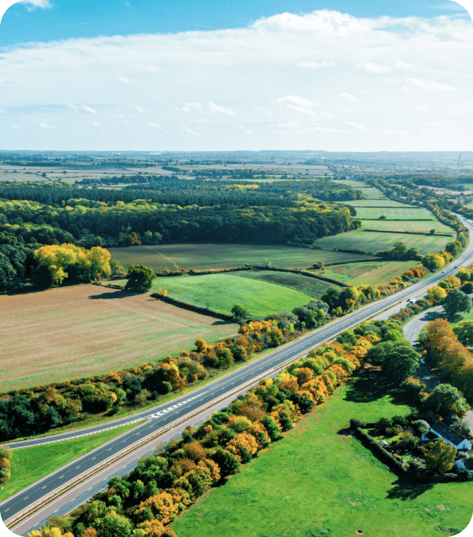Aerial view of open land and roads, representing land-only financing available through Guardian CU’s Home Loans program