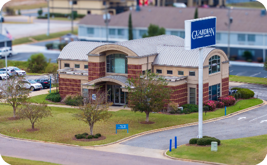 Exterior view of Guardian Credit Union’s Prattville at Interstate Court branch building, with visible parking lot and landscaped surroundings